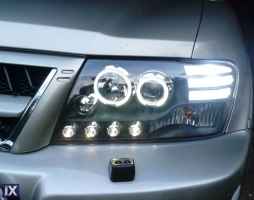 Φανάρια εμπρός angel eyes για Mitsubishi Pajero (2001-2006) - μαύρα , με λάμπες (Η1) - σετ 2τμχ.